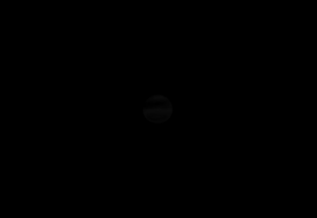 A faint gray circle centered on a black background.